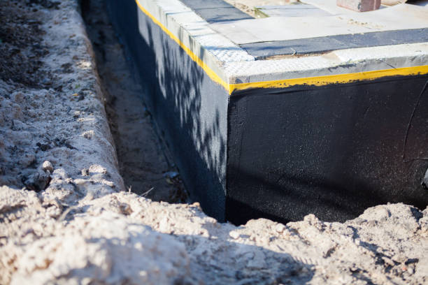 Professional Waterproofing technician working in Hampton, MD